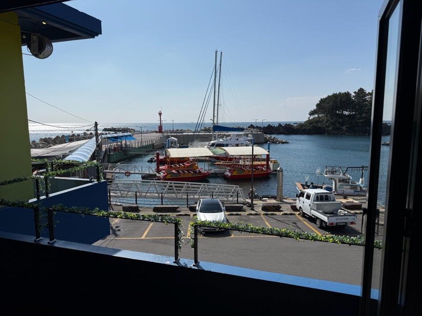A view of a harbor from a window
AI-generated content may be incorrect.