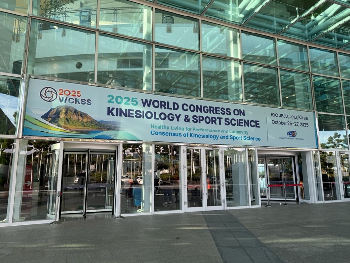 A large glass building with a sign
AI-generated content may be incorrect.