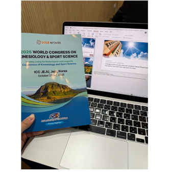 A hand holding a book next to a computer
AI-generated content may be incorrect.